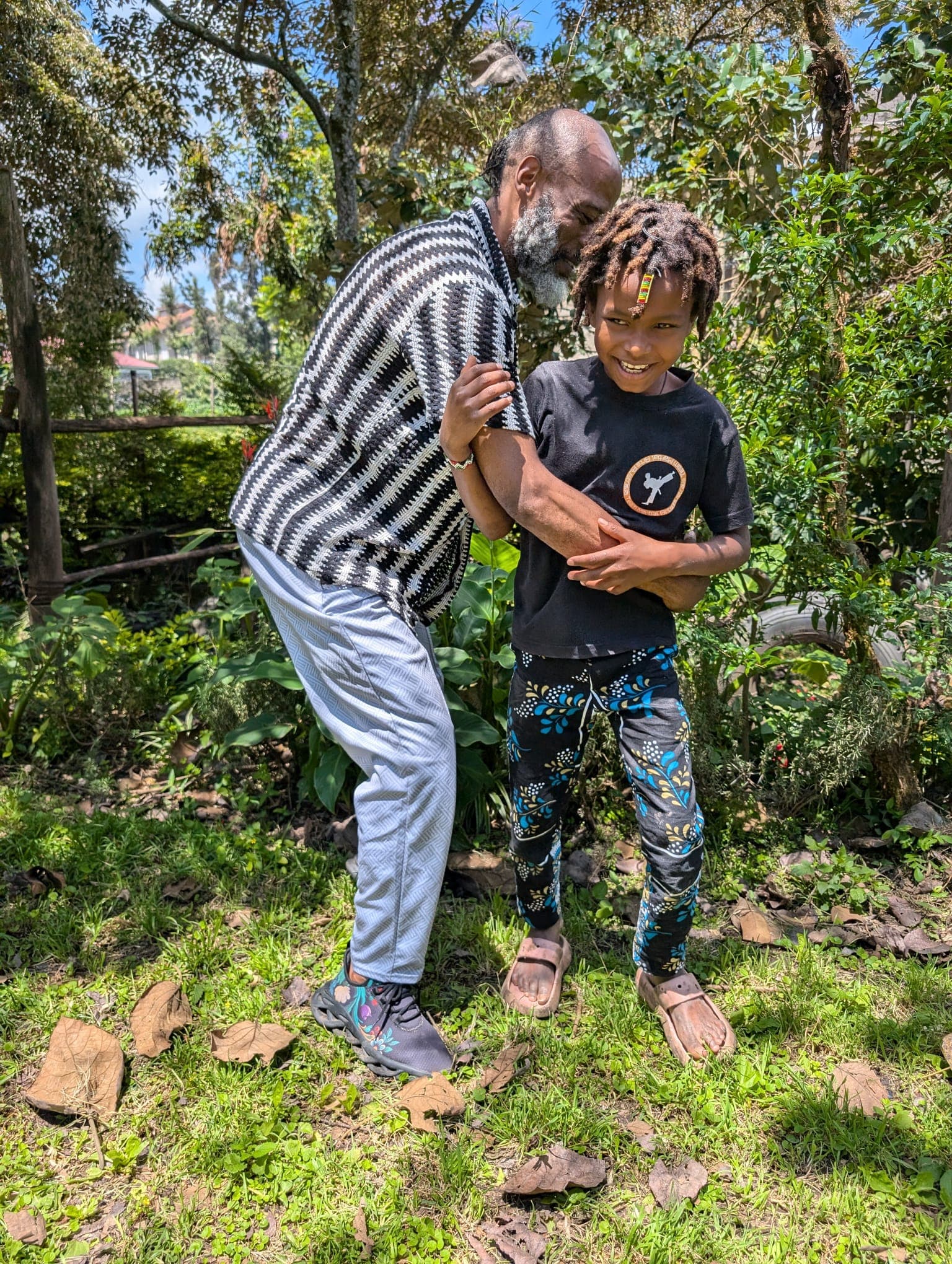 Djedi play fighting with Muthima